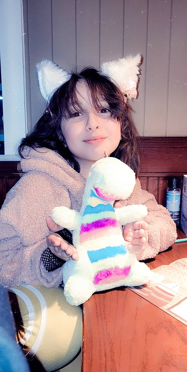 Alyssandra joined the competition — help win amazing prizes! bangs, child, ear, eye, eyelash, fur, glove, happy, hime_cut, human_leg, nail, outerwear, person, picture_frame, pink, plush, stuffed_toy, thumb, toy, white
