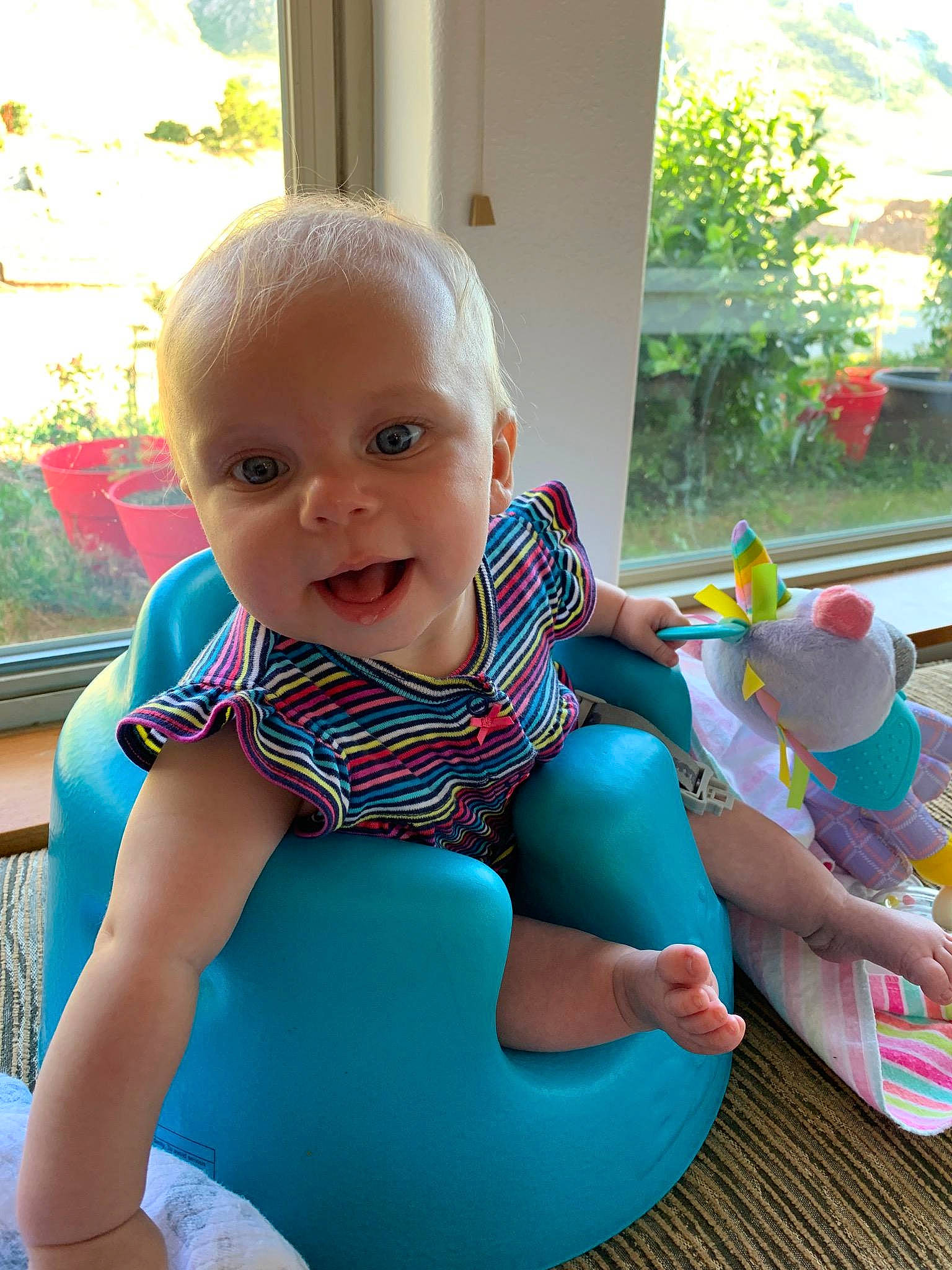Gwen joined the competition — help win amazing prizes! baby, child, fun, leg, leisure, person, play, recreation, sitting, smile, sportswear, summer, toddler, turquoise, vacation