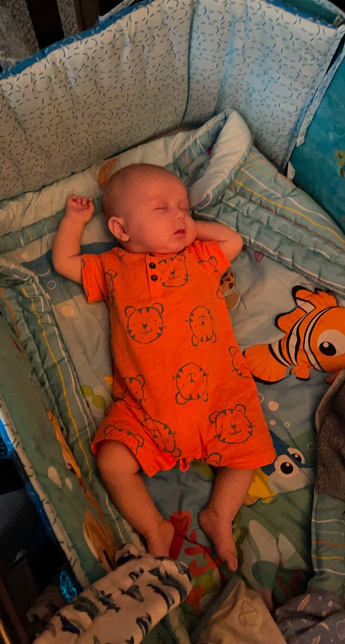 Kolson joined the competition — help win amazing prizes! baby, baby_sleeping, baby_toddler_clothing, child, comfort, couch, eye, flooring, fun, infant_bed, lap, leg, linens, mouth, orange, pattern, person, sitting, skin, textile
