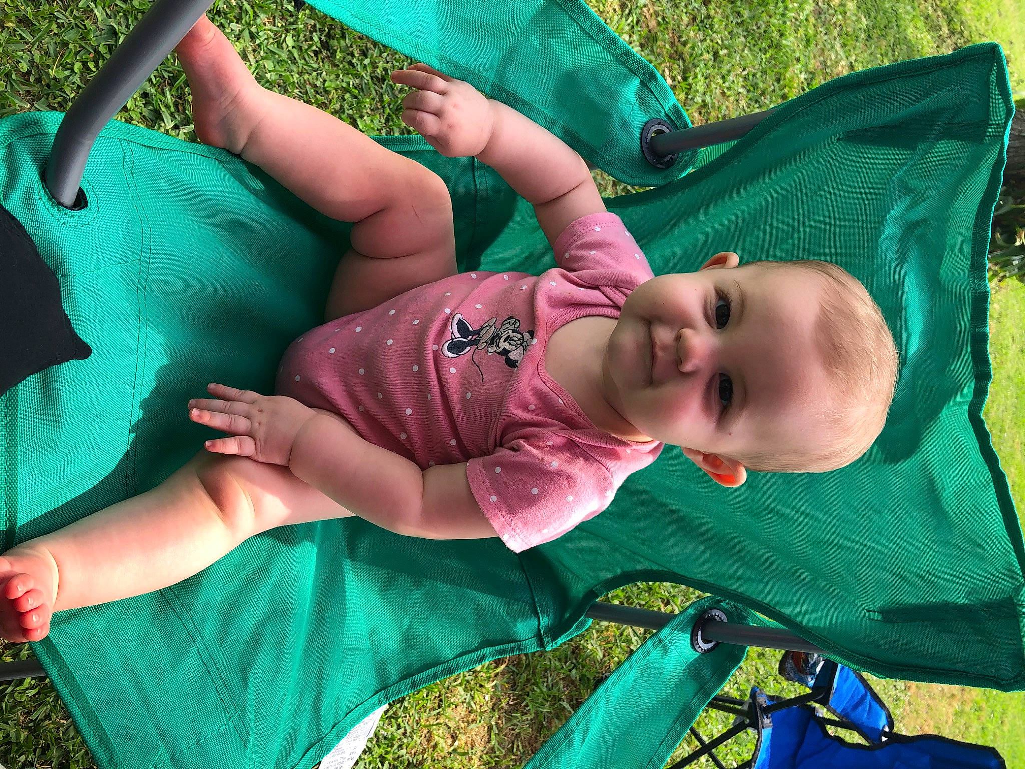 Haylie is registered to the contest to win money with this photo: arm, baby, baby_toddler_clothing, blue, child, cool, event, fun, grass, green, hand, happy, hat, jewellery, joy, leisure, person, recreation, summer, textile