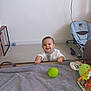 Rafael a rejoint le concours — aidez-le/la à gagner de superbes lots ! baby, child, smiling, indoor, blanket, toy, green_ball, floor, baby_rocker, furniture, happy, person, clothing, hand, head, face, room, playing, curious, young_child