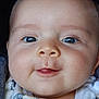 Nolan participe au concours pour gagner de l'argent avec cette photo : baby, close_up, face, smile, blue_eyes, chubby_cheeks, tongue, cute, infant, skin, expression, adorable, child, person, portrait, young, happy, head, clothing, indoors