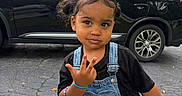 Laneigh joined the competition — help win amazing prizes! bench, black_shirt, black_suv, bracelet, car, child, curly_hair, daylight, denim_overalls, expression, girl, grass, hand_gesture, outdoor, park, pigtails, portrait, toddler, trees, wooden_bench