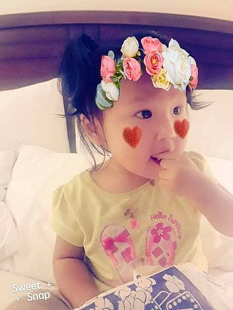 Cecelia is registered to the contest to win money with this photo: baby, beauty, child, cut_flowers, ear, fashion_accessory, flower, hair_accessory, headband, headgear, headpiece, nose, person, petal, pink, plant, skin, textile, toddler