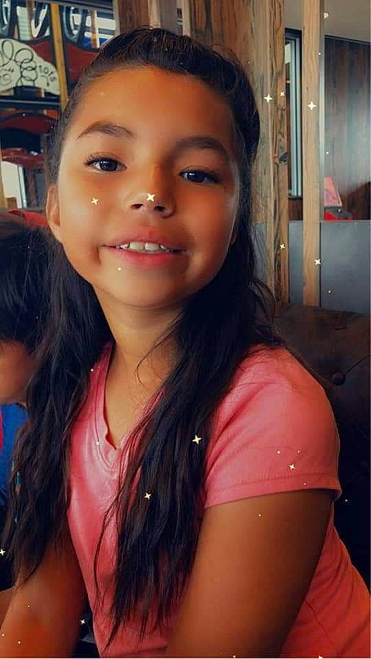 Ana is registered to the contest to win money with this photo: black_hair, bookcase, cheek, cool, eyebrow, eyelash, forehead, friendship, fun, happy, iris, jaw, joy, layered_hair, lip, mouth, neck, nose, person, shelf