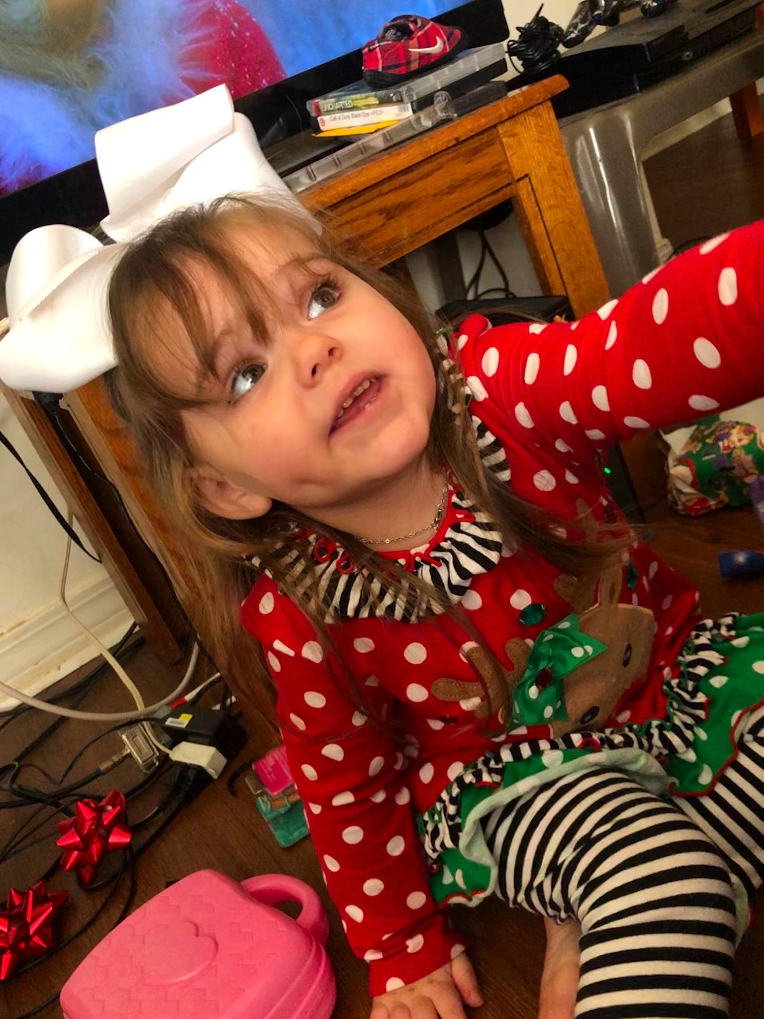 Lydia Starr joined the competition — help win amazing prizes! chest_of_drawers, child, christmas, christmas_eve, christmas_ornament, design, drawer, event, facial_expression, fun, hairstyle, happy, hat, holiday, human_body, pattern, person, sitting, sleeve, thigh