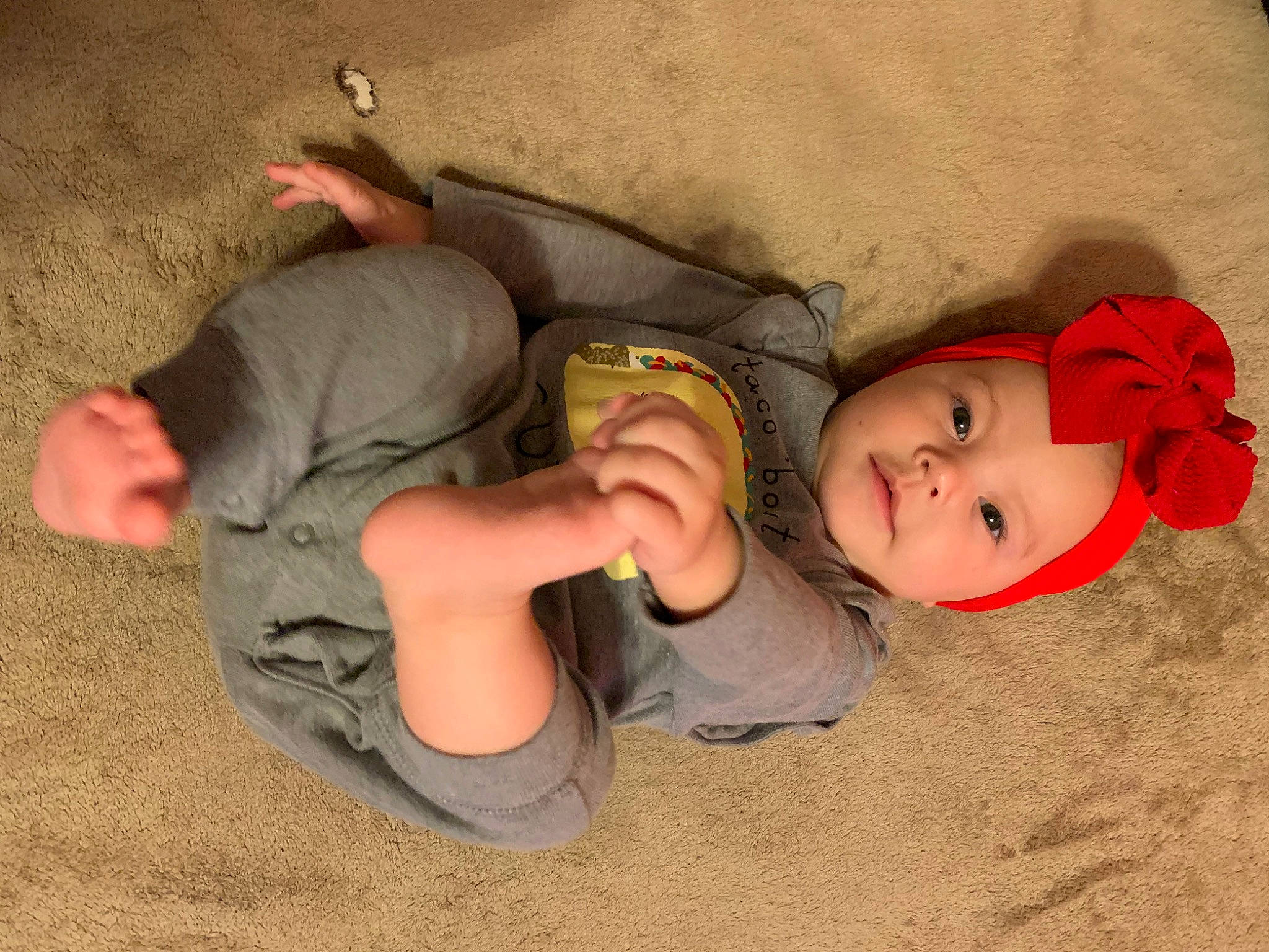 Layla Rose is registered to the contest to win money with this photo: baby, baby_toddler_clothing, child, comfort, elbow, finger, flooring, fun, happy, headwear, human_leg, knee, leg, mammal, mouth, nose, person, skin, smile, thigh