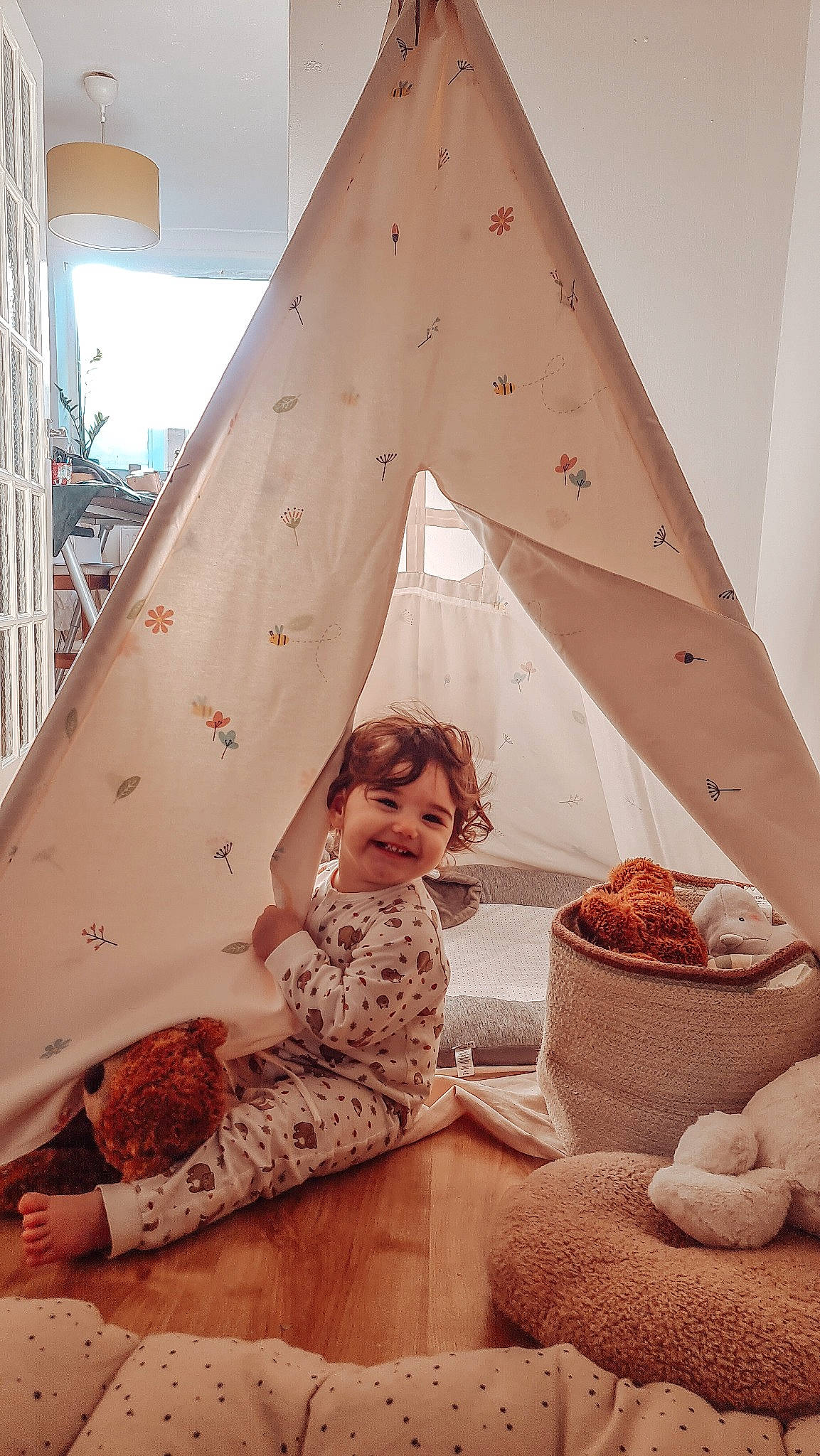 Leyla is registered to the contest to win money with this photo: child, comfort, design, flooring, fun, interior_design, joy, leisure, linens, living_room, pattern, peach, people, person, photograph, pink, room, sitting, snapshot, textile