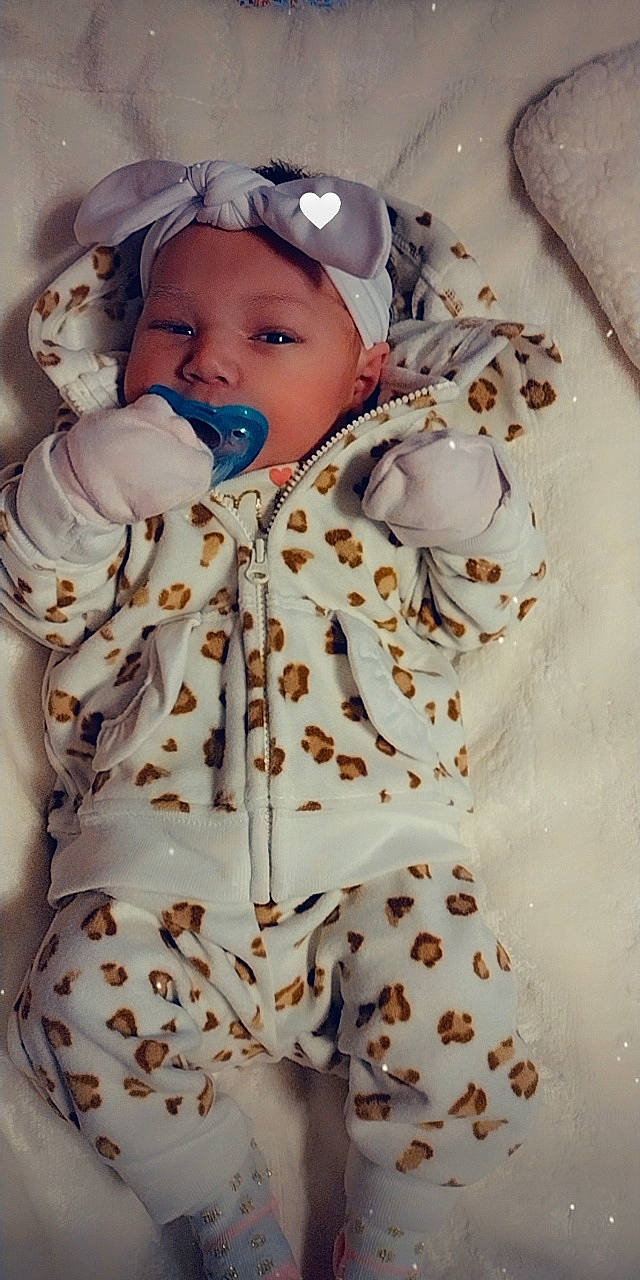 Kayleeanna is registered to the contest to win money with this photo: baby, baby_toddler_clothing, cap, child, collar, eye, face, fashion_design, happy, head, headgear, headwear, jacket, linens, pattern, person, skin, sleeve, textile, toddler