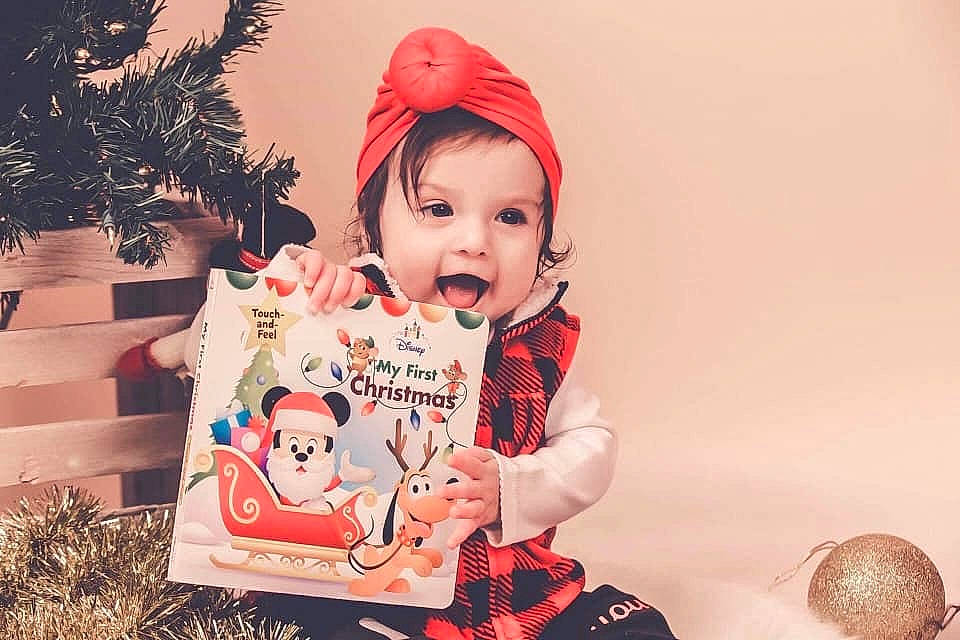 Avalina is registered to the contest to win money with this photo: baby, child, christmas, christmas_eve, happy, headwear, person, pink, sleeve, toddler