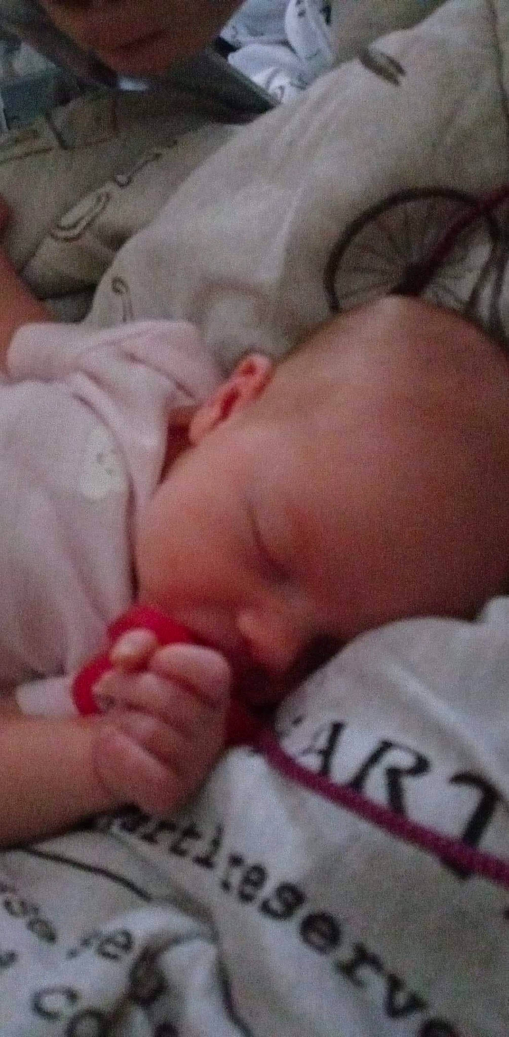 Everest is registered to the contest to win money with this photo: baby, bedtime, birth, cheek, child, close_up, finger, flesh, foot, hand, leg, lip, mouth, muscle, nail, nap, nose, person, skin, sleep