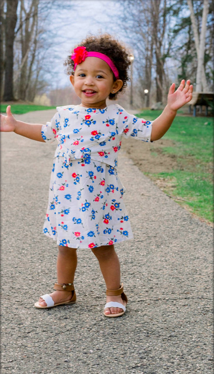 Amayah is registered to the contest to win money with this photo: baby_toddler_clothing, child, clothing, design, dress, flower, joy, pattern, person, pink, plant, play, sleeve, spring, standing, toddler, tree, walking