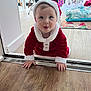 éléa participe au concours pour gagner de l'argent avec cette photo : baby, child, santa_claus_costume, crawling, doorway, christmas_tree, holiday, festive, indoor, flooring, curious, tongue_out, red_clothing, white_fur_trim, cushion, decor, person, happy, home, seasonal
