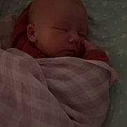 Evie joined the competition — help win amazing prizes! baby, sleeping, blanket, soft, checkered, bed, star_pattern, peaceful, infant, face, hand, cozy, resting, child, cute, pajamas, indoors, newborn, calm, toddler