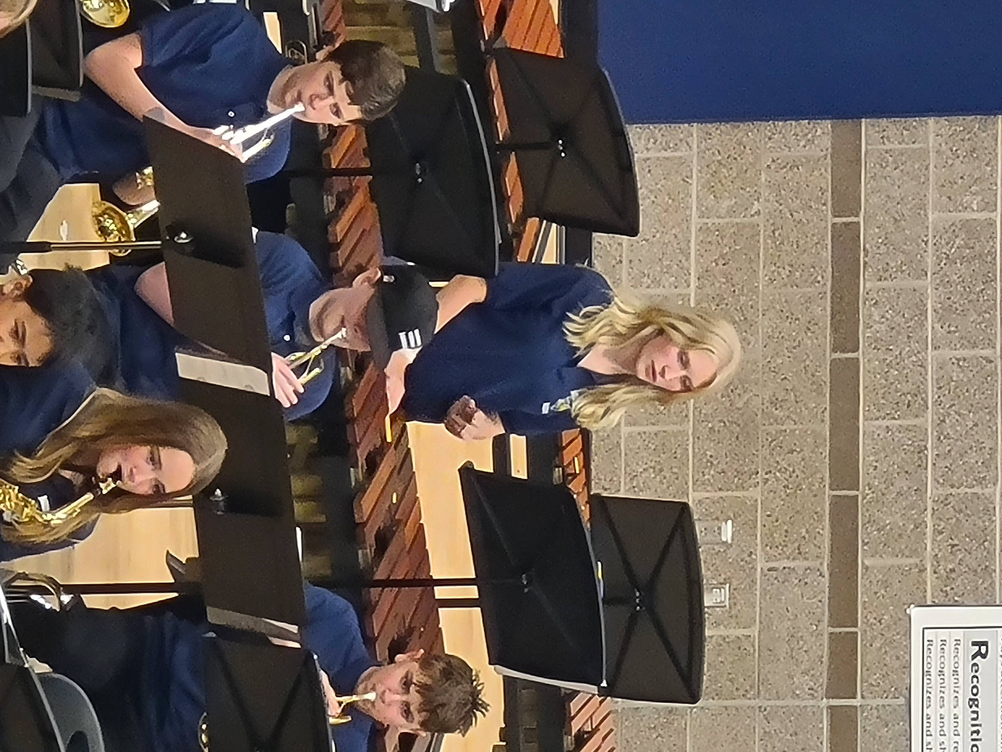 Tori joined the competition — help win amazing prizes! academic_dress, academic_institution, chair, entertainment, event, graduation, hat, headwear, mortarboard, music, musical_instrument_accessory, musician, performance, person, phd, public_event, room, scholar, suit, team