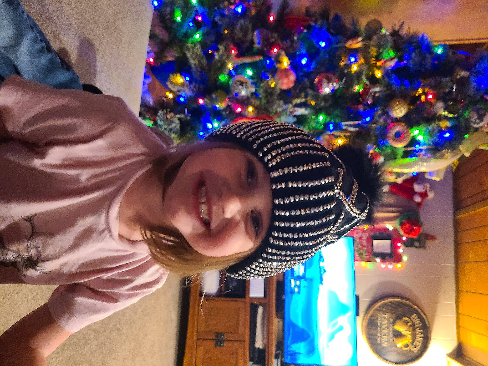 Roxanne is registered to the contest to win money with this photo: child, christmas, christmas_decoration, christmas_ornament, christmas_tree, electric_blue, event, fun, happy, hat, headwear, holiday, holiday_ornament, joy, leisure, light, ornament, party_supply, person, purple