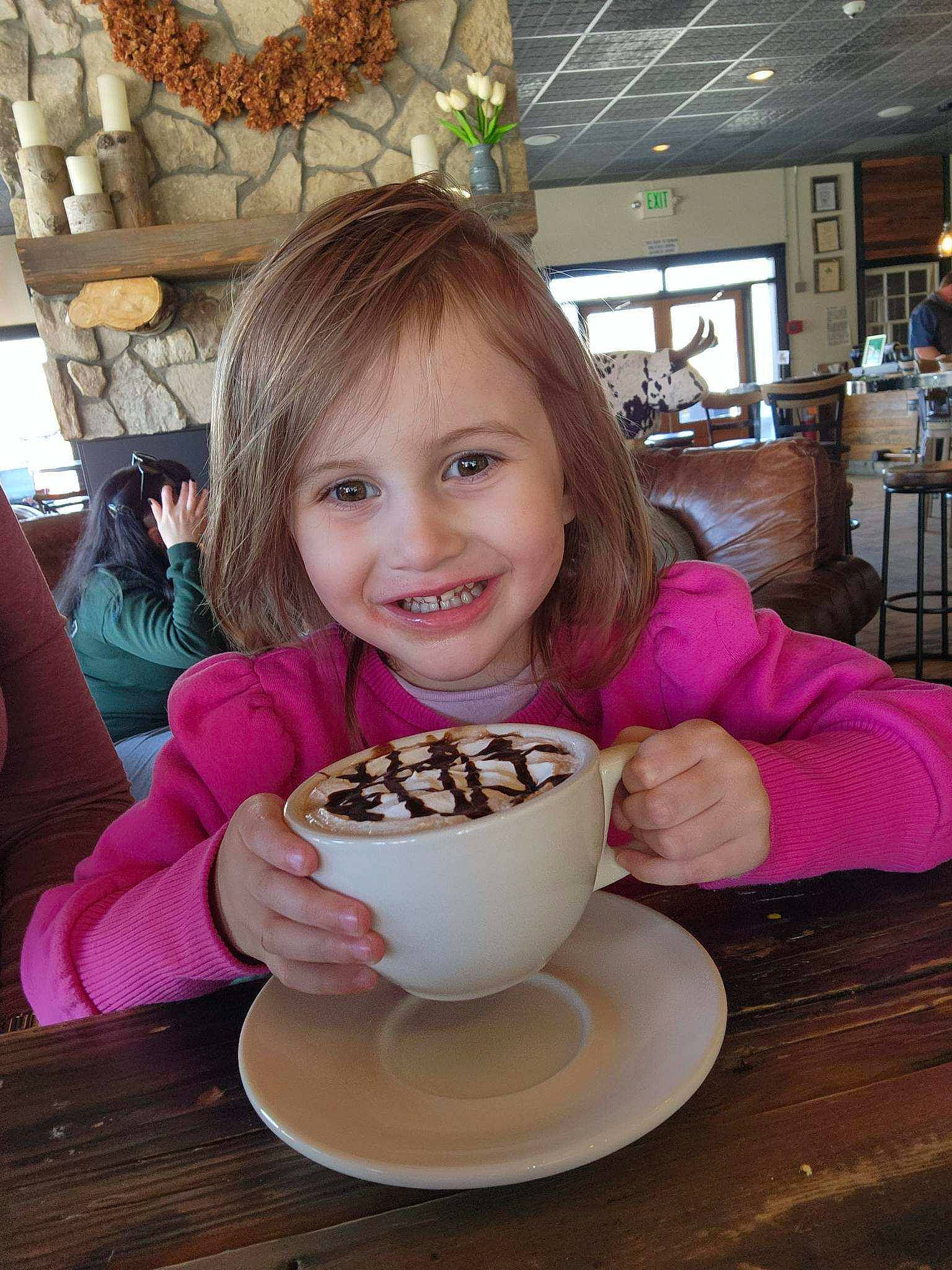 Roxanne is registered to the contest to win money with this photo: chair, cuisine, cup, dish, drinkware, food, food_craving, happy, houseplant, ingredient, joy, kitchen_utensil, person, plant, plate, serveware, smile, spoon, table, tableware