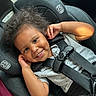 Malik joined the competition — help win amazing prizes! child, toddler, car_seat, smile, curly_hair, seatbelt, happy, sitting, clothing, gray_shirt, black_pants, interior, car, safety, baby, cute, portrait, infant, young_child, playful