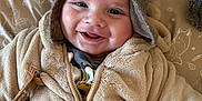 Nahël participe au concours pour gagner de l'argent avec cette photo : baby, beige, child, cozy, cushion, cute, deer, face, fleece_jacket, happy, hat, indoor, infant, lying_down, pattern, person, pom_pom, smiling, squirrel, woodland_animals