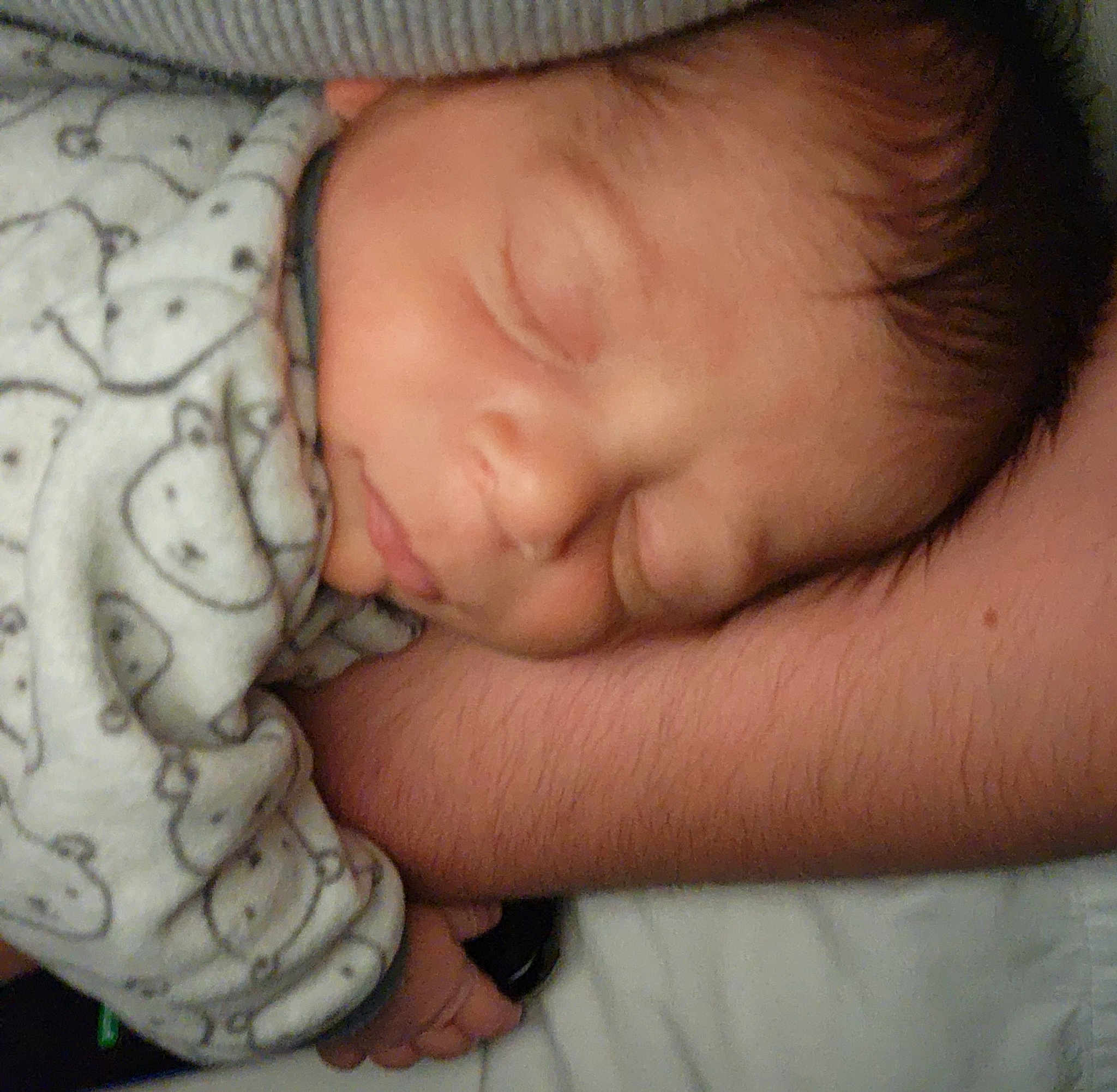Jasper is registered to the contest to win money with this photo: arm, baby, baby_sleeping, baby_toddler_clothing, bedtime, cheek, child, comfort, finger, flesh, gesture, human_body, linens, mouth, nose, pattern, skin, sleeve, thumb, toddler
