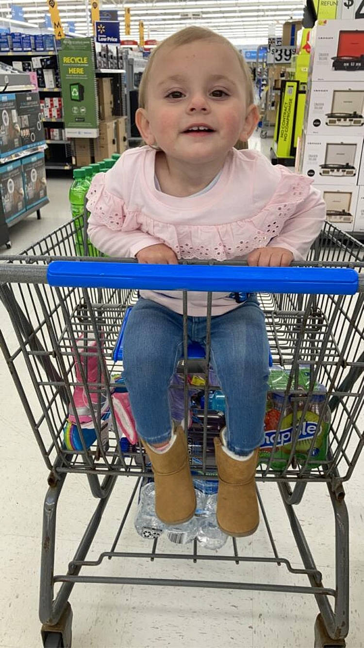 Nevaeh Star is registered to the contest to win money with this photo: beauty, child, chin, clothing, customer, fun, green, human_body, leisure, organ, people, person, photograph, product, shelf, shopping_cart, smile, standing, tire, toddler