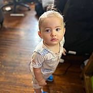 Jadeziah joined the competition — help win amazing prizes! toddler, child, indoor, wooden_floor, pajamas, blue_shoes, curious, standing, person, face, young_child, hair_tied, footwear, home, blurred_background, furniture, expression, looking_up, casual_clothing, cute