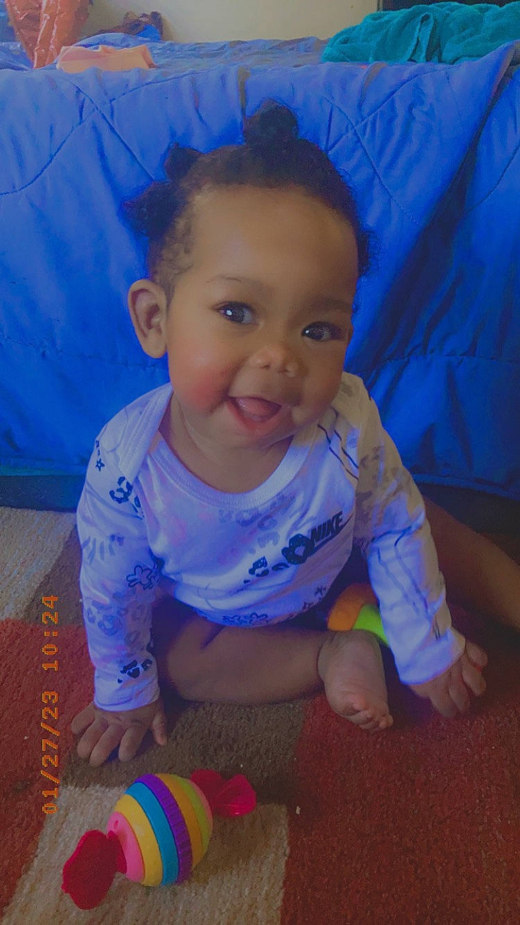 Camilla joined the competition — help win amazing prizes! baby, baby_products, baby_toddler_clothing, blue, cheek, child, cloud, electric_blue, flooring, fun, happy, head, iris, nose, person, play, sitting, skin, smile, toddler