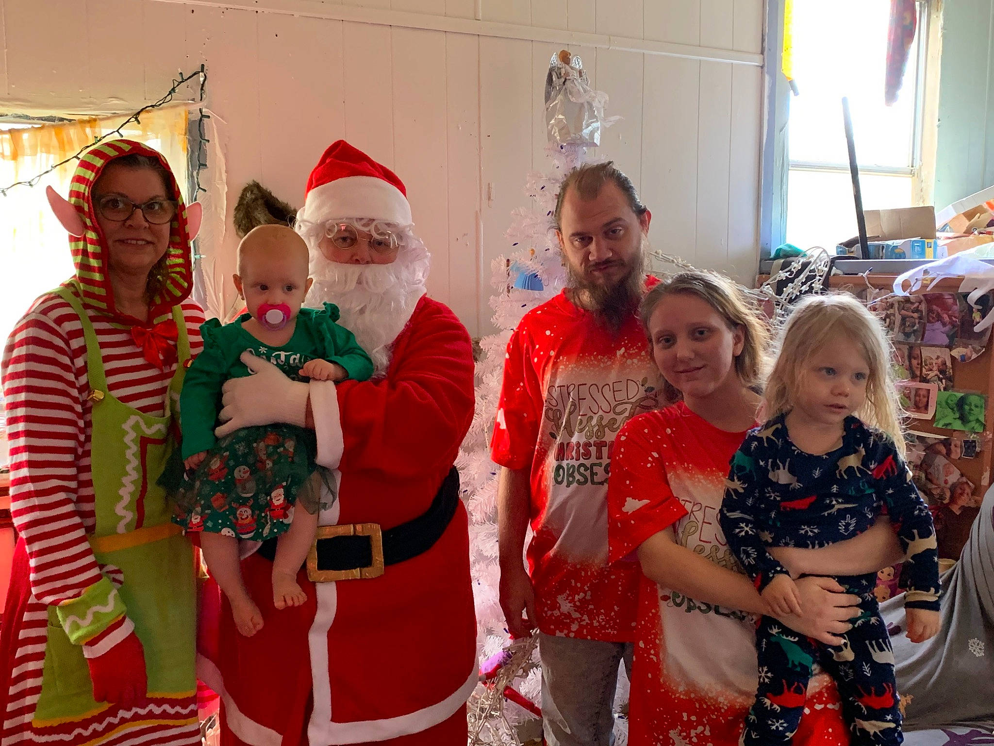 Raelynn joined the competition — help win amazing prizes! beard, child, christmas, christmas_decoration, christmas_eve, costume, event, fun, happy, hat, holiday, joy, lap, leisure, person, santa_claus, shorts, smile, t_shirt, team