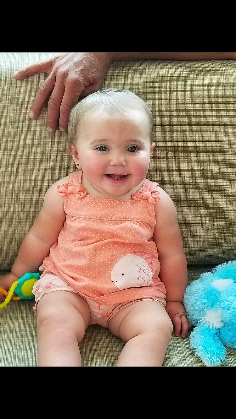 Zoey joined the competition — help win amazing prizes! baby, baby_products, baby_toddler_clothing, beauty, cheek, child, diaper, ear, eye, face, finger, head, iris, joy, lip, pattern, person, pink, sitting, skin