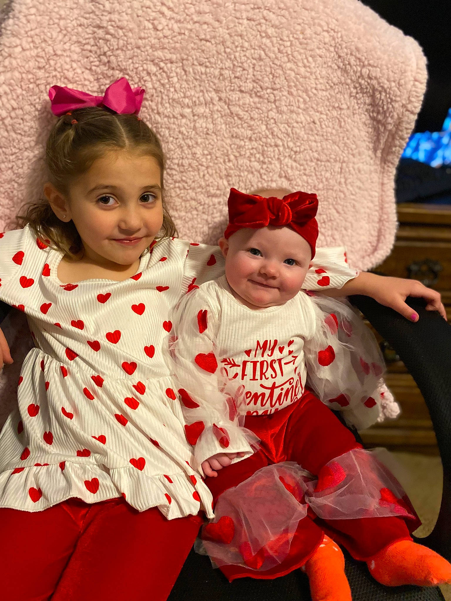 Allison joined the competition — help win amazing prizes! baby_toddler_clothing, child, christmas, christmas_eve, costume, costume_hat, event, facial_expression, fictional_character, fun, happy, headwear, holiday, joy, lap, pattern, person, pink, red, sleeve