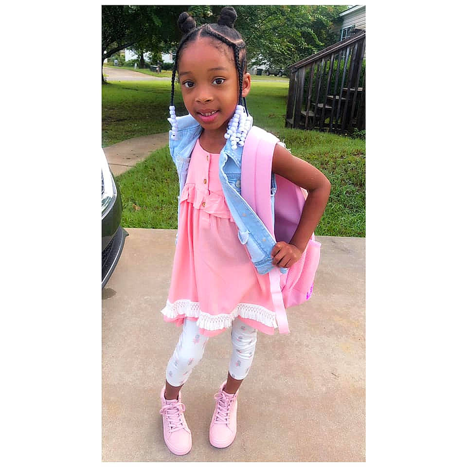 Camille is registered to the contest to win money with this photo: child, child_model, clothing, costume, dress, fashion, fashion_accessory, footwear, jacket, outerwear, person, pink, plant, play, recreation, scarf, shoe, street_fashion, tights, toddler