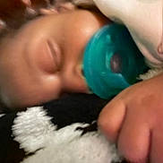 Dahari joined the competition — help win amazing prizes! baby, pacifier, sleeping, close_up, blanket, soft_texture, infant, hand, resting, cozy, indoors, child, face, skin, comfort, peaceful, toddler, lying_down, young_child, nap