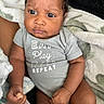 Dahari joined the competition — help win amazing prizes! baby, infant, onesie, clothing, face, expression, blanket, skin, hand, fist, arm, leg, person, newborn, cute, indoors, soft_texture, closeup, child, portrait