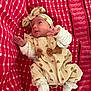 baby, infant, headband, bow, heart_pattern, white_socks, red_blanket, checkered_blanket, cute, newborn, clothing, small_hands, lying_down, soft_fabric, patterned_clothing, adorable, portrait, indoors, happy_expression, child