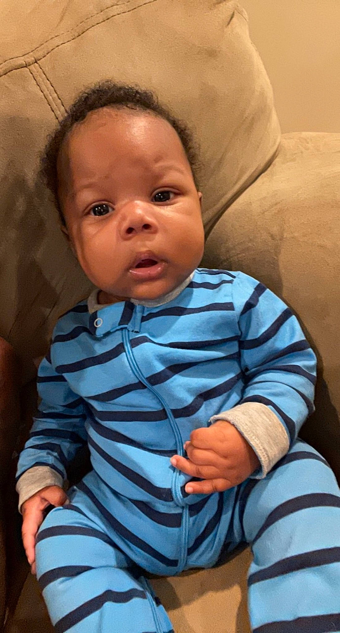 Jaiden is registered to the contest to win money with this photo: baby, baby_toddler_clothing, cheek, child, chin, collar, comfort, eye, eyelash, flash_photography, head, iris, lip, mouth, neck, nose, person, sitting, skin, sleeve