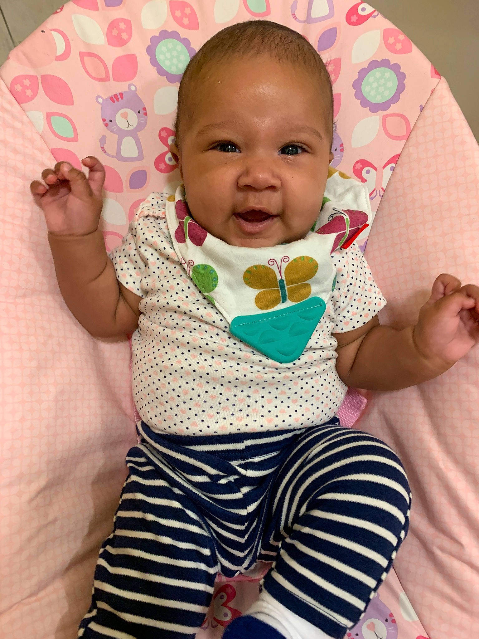 Cassie is registered to the contest to win money with this photo: baby, baby_products, baby_toddler_clothing, cheek, child, head, neck, person, pink, product, sitting, skin, sleeve, textile, toddler