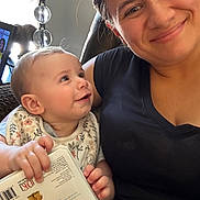 Lainee joined the competition — help win amazing prizes! baby, book, candid, casual, child, closeup, clothing, expression, face, family, happy, holding, home, indoor, love, person, portrait, sitting, smile, woman