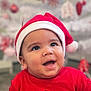Kenny joined the competition — help win amazing prizes! baby, child, smiling, red_clothing, santa_hat, holiday, christmas, festive, cute, indoors, portrait, happy, holiday_decorations, seasonal, celebration, face, infant, closeup, cheerful, background_blur