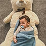 baby, sleeping, pacifier, blanket, teddy_bear, plush_toy, carpet, indoor, child, cute, cozy, rest, nap, soft, comfort, toy, infant, wrapped, peaceful, sleep