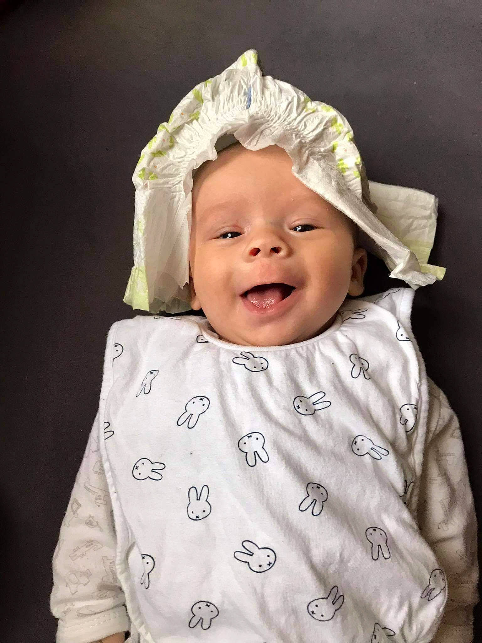 Owen participe au concours pour gagner de l'argent avec cette photo : baby, baby_laughing, baby_toddler_clothing, cheek, child, comfort, eye, face, facial_expression, fashion_accessory, flash_photography, fun, happy, headgear, headwear, monochrome_photography, pattern, person, portrait_photography, sleeve