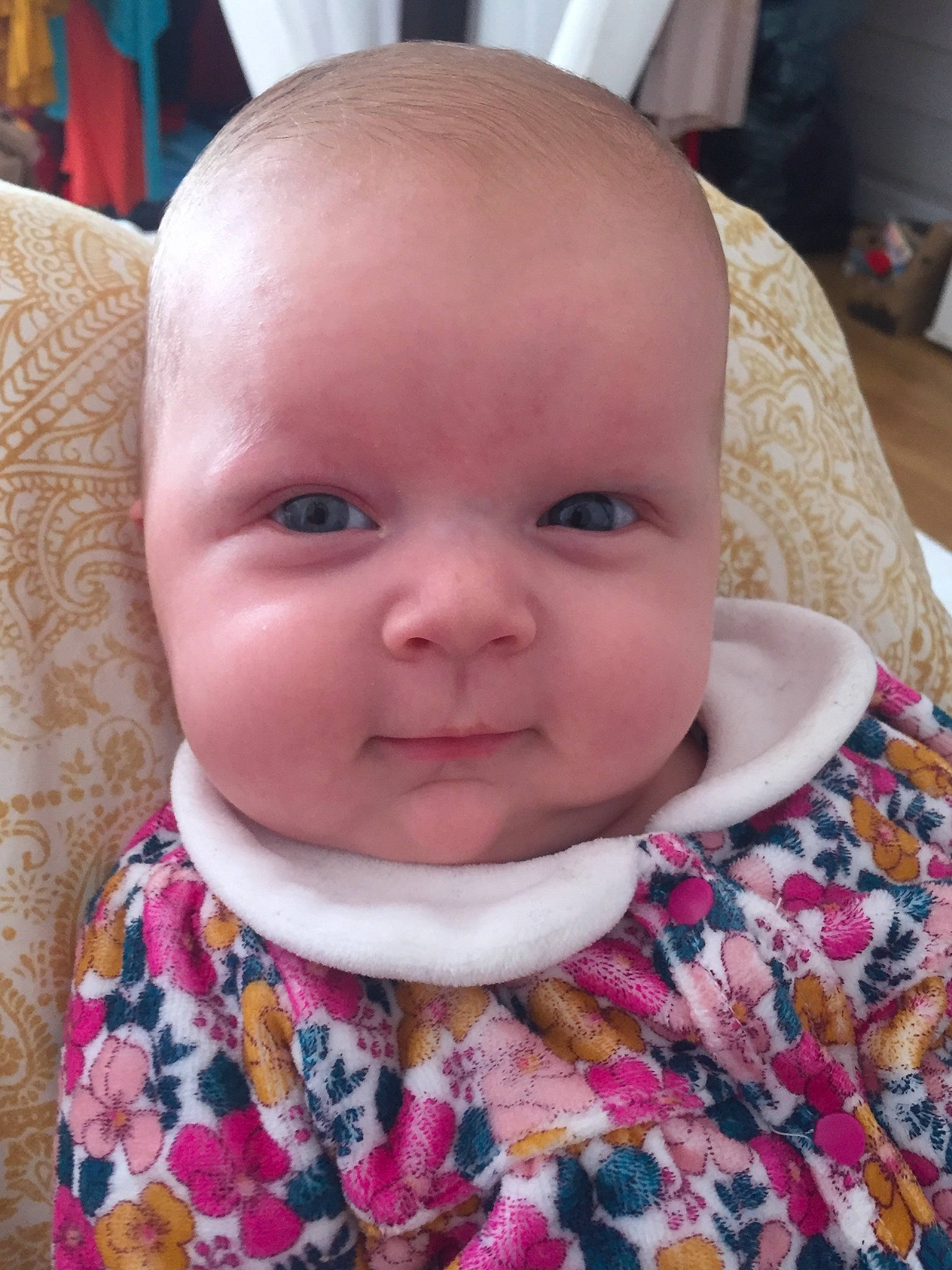 Savannah participe au concours pour gagner de l'argent avec cette photo : baby, baby_toddler_clothing, bib, cheek, child, clothing, collar, eye, eyelash, grass, happy, iris, nose, pattern, person, pink, sitting, skin, sleeve, smile