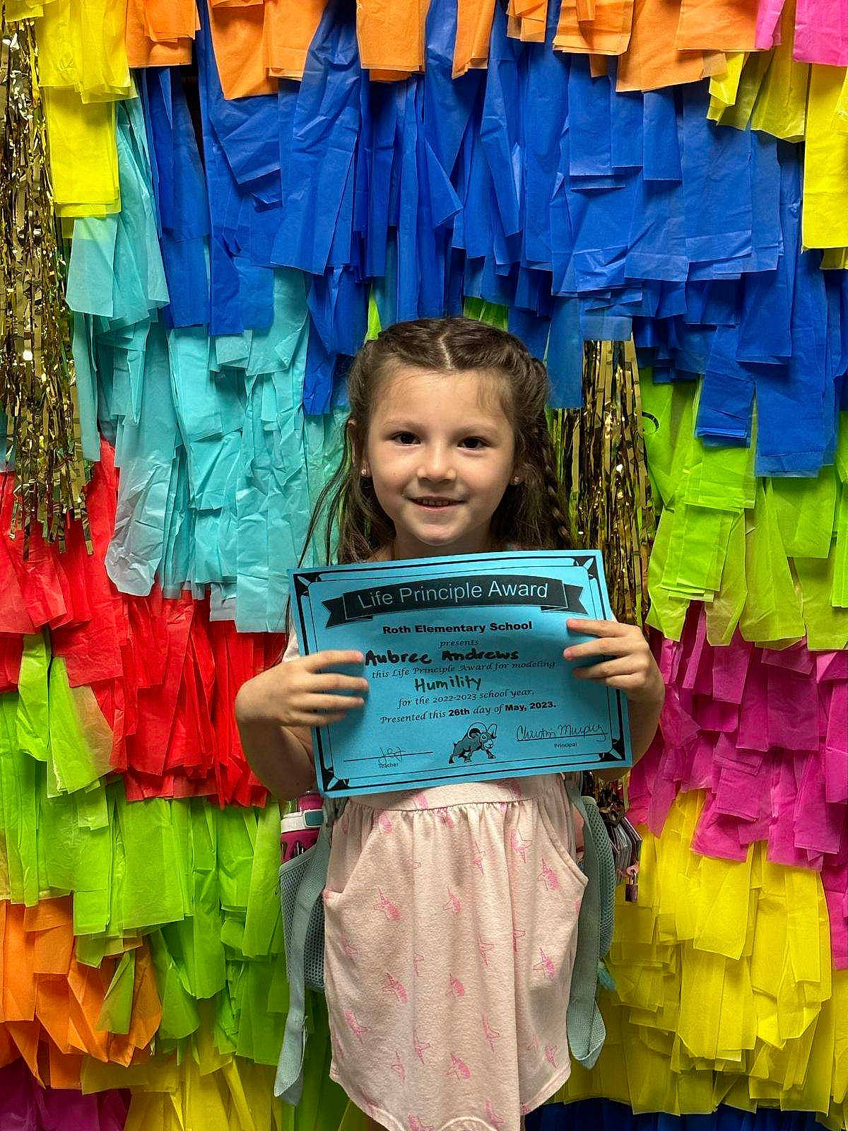 Aubree is registered to the contest to win money with this photo: blue, clothing, community, denim, electric_blue, fashion_design, green, happy, joy, outerwear, person, pink, product, retail, sleeve, smile, snapshot, standing, t_shirt, textile