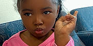 Eliyah joined the competition — help win amazing prizes! child, girl, pink_sweater, hair_clips, pouty_face, blue_chair, indoor, hand_gesture, purse, cute, portrait, seated, curly_hair, casual_clothing, expression, young_child, furniture, home, person, fashion