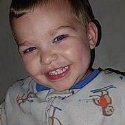 Jason joined the competition — help win amazing prizes! child, toddler, smiling, face, blue_eyes, pajamas, monkey_pattern, clothing, cute, happy, portrait, indoor, young_child, baby_teeth, cozy, person, apparel, head, skin, expression