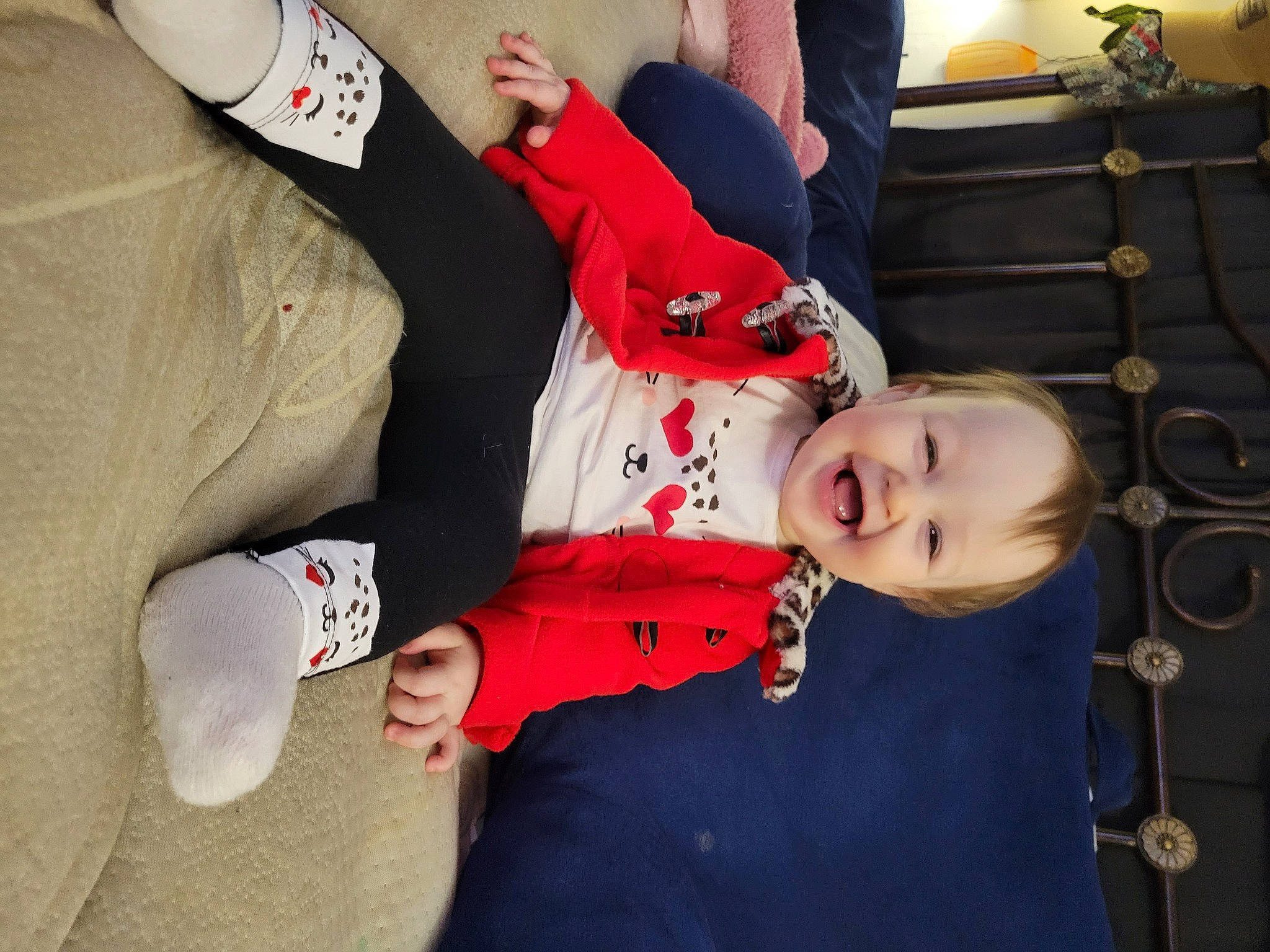 Juliet is registered to the contest to win money with this photo: arm, baby, baby_products, baby_toddler_clothing, carmine, child, comfort, elbow, event, fun, gesture, happy, joy, lap, person, sitting, sleeve, smile, thigh, toddler