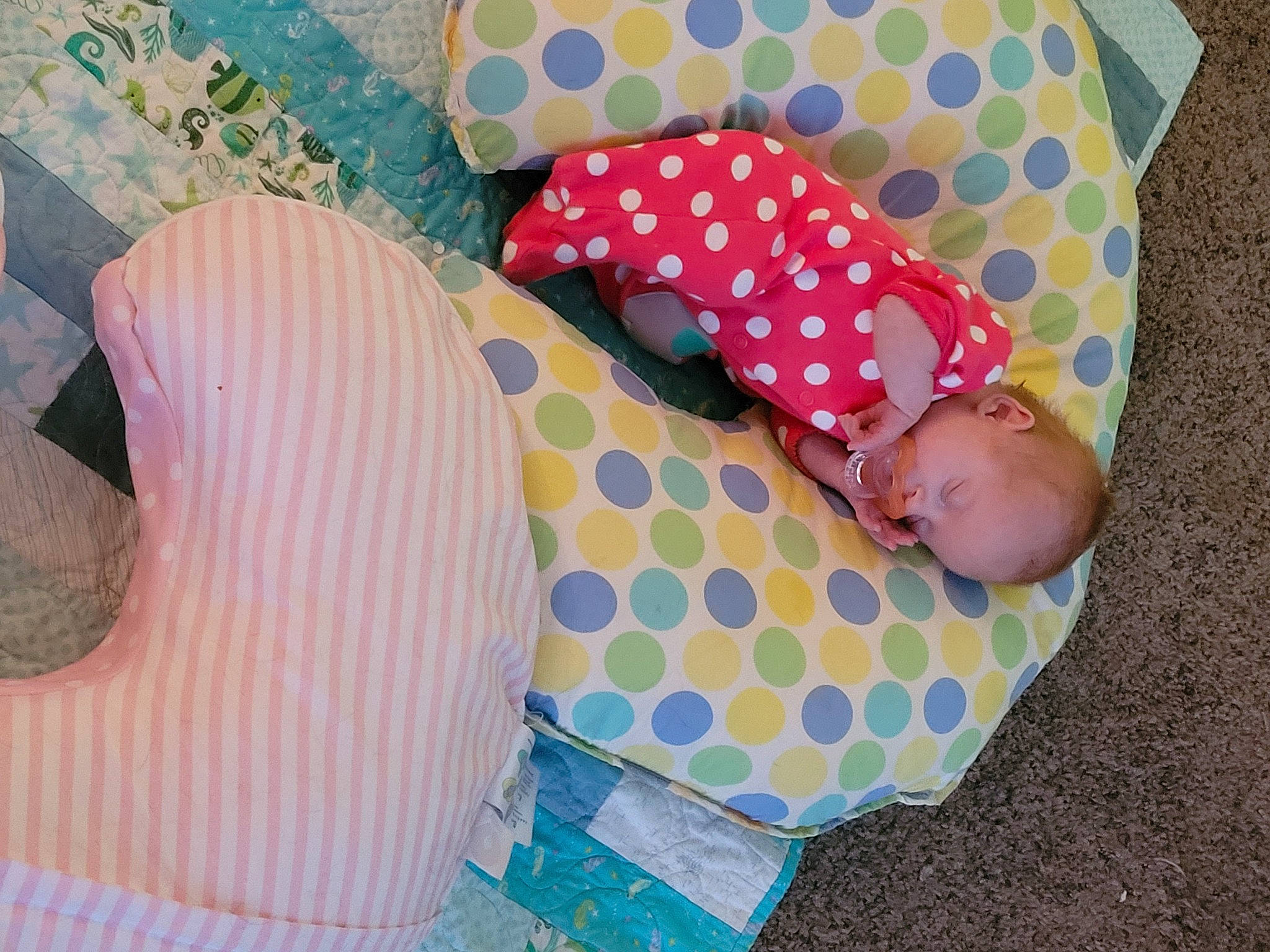 Korra is registered to the contest to win money with this photo: baby, baby_products, baby_toddler_clothing, beauty, bedding, child, comfort, design, fashion_accessory, linens, pattern, person, pink, polka_dot, product, sleeve, sunglasses, textile, toddler, white