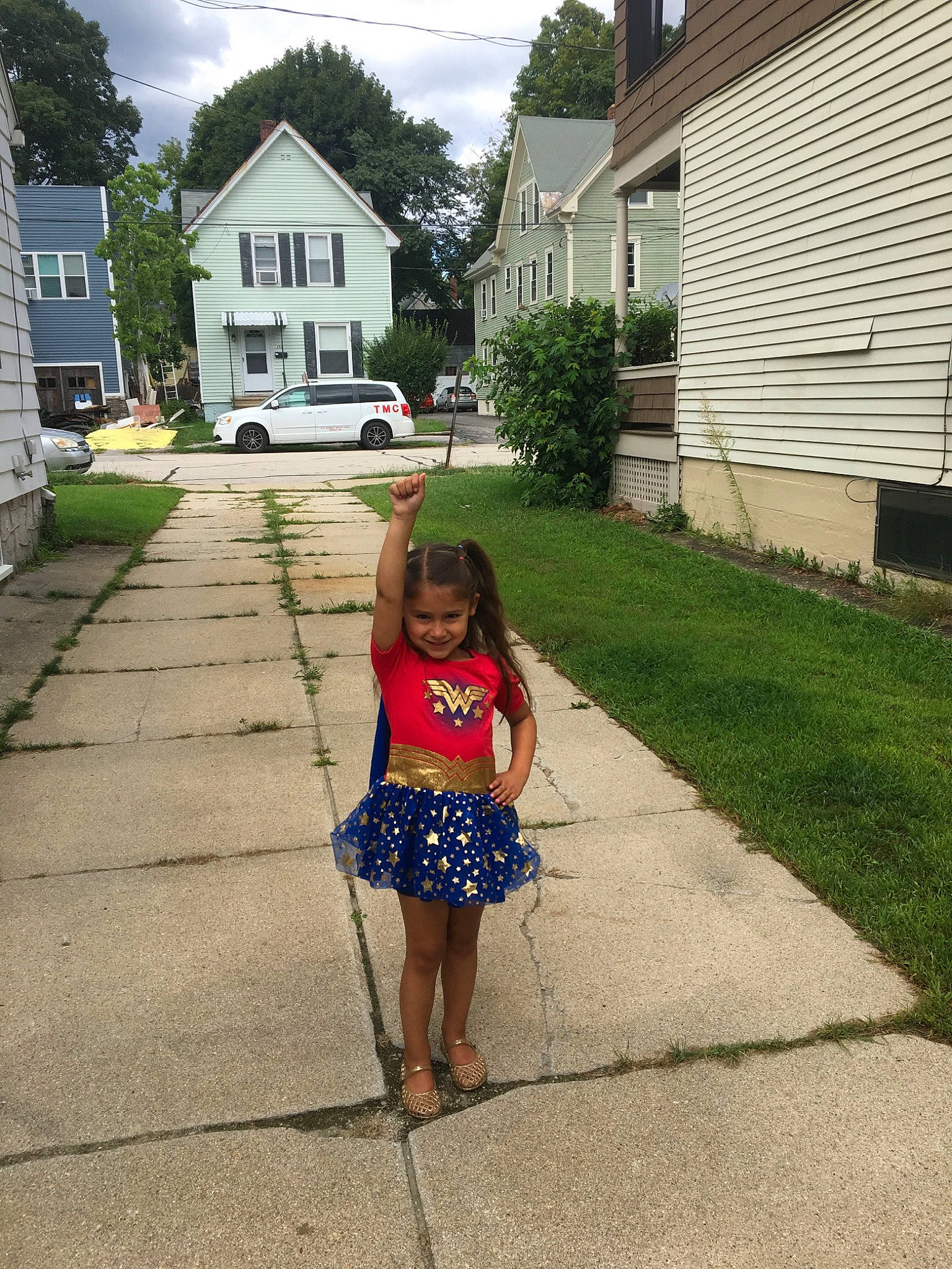 Bridget joined the competition — help win amazing prizes! child, dress, driveway, grass, home, house, joy, lawn, person, plant, residential_area, shoe, sidewalk, summer, tree, vacation, walking, yard