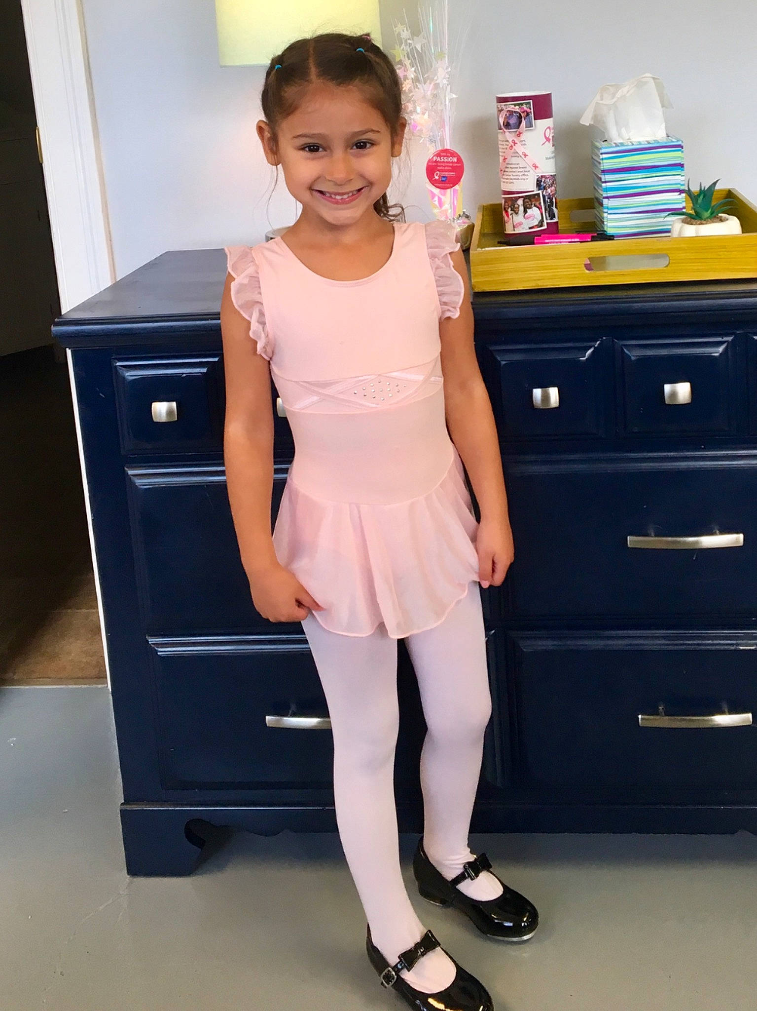 Bridget joined the competition — help win amazing prizes! chest_of_drawers, child, clothing, drawer, dress, fashion_design, filing_cabinet, footwear, furniture, joy, person, room, shoe, standing, toddler