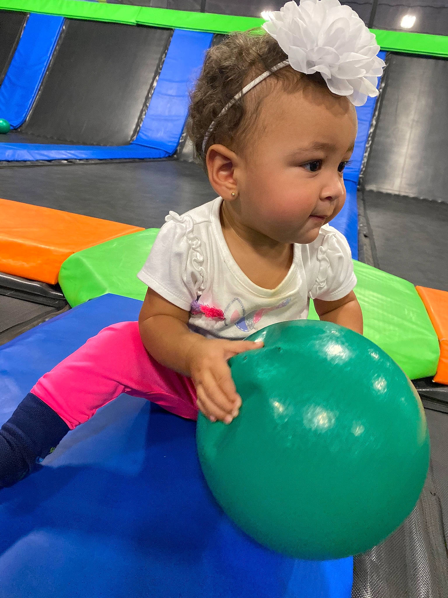 Amina is registered to the contest to win money with this photo: ball, child, fun, games, inflatable, leisure, person, play, playground, recreation, sitting, smile, toddler, world