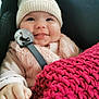 baby, smiling, hat, knit_hat, pacifier, blanket, red_blanket, fuzzy_jacket, pink_clothing, cute, infant, child, portrait, closeup, warm_clothing, cozy, happy, indoor, person, baby_hand